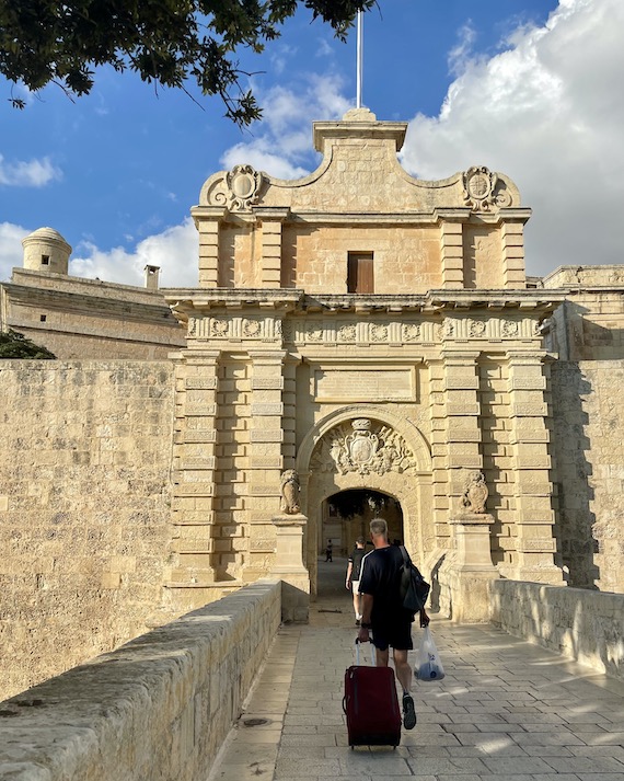 Walking with suitcases to Malta Xara Palace