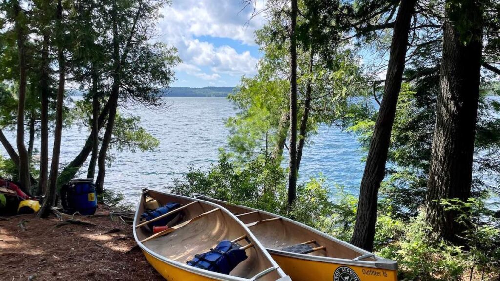 Ralph Bice lake - trees, lake and canoes