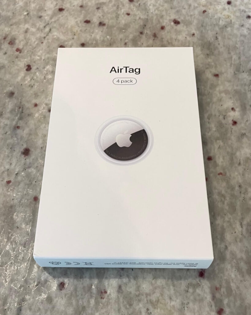 Apple airtags in box on kitchen counter