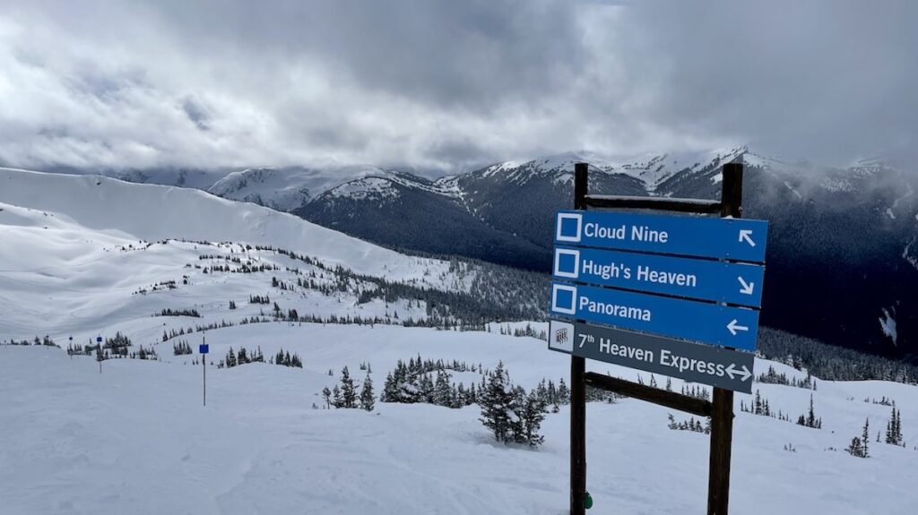 Blue runs on signs in Whistler vs Blackcomb - 7th Heaven slopes