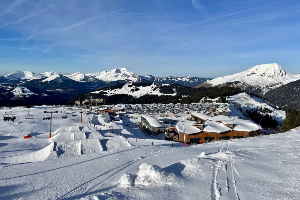Morzine snow park jumps with car park in distance