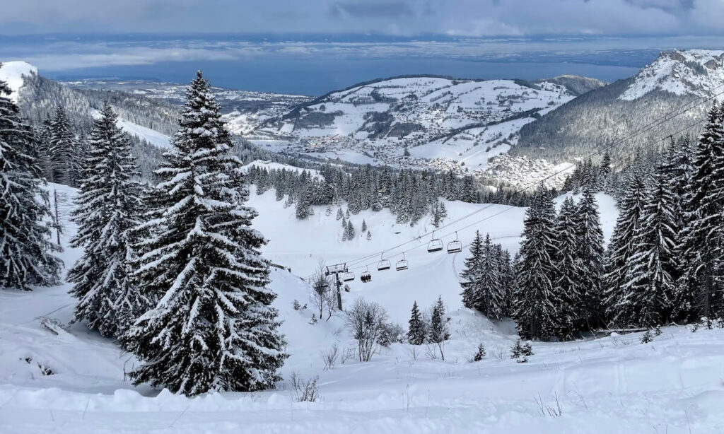 Bernex Ski resort after snowfall - chairlift and village