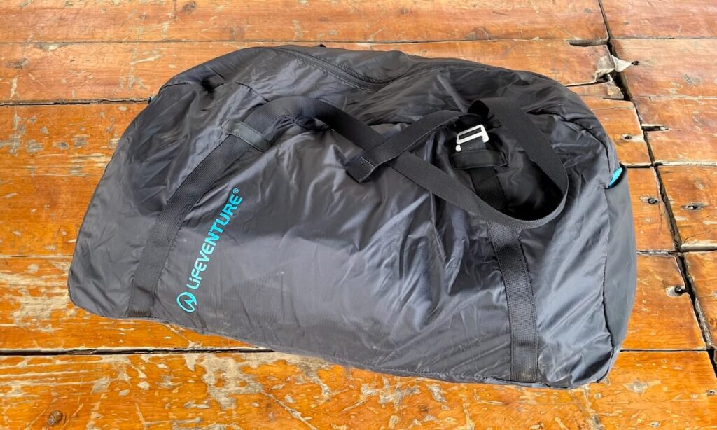 Ellis Brigham lifeventure duffle bag on scratched wooden
