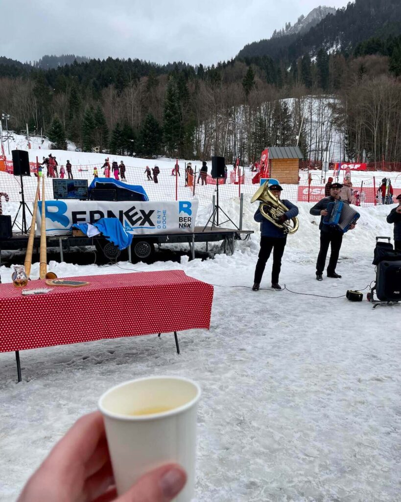 Bernex winter activities - man playing trumpet and free wine