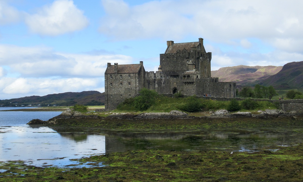 Eilean Donan Castle on the loch with murky water - Isle of Skye Scotland