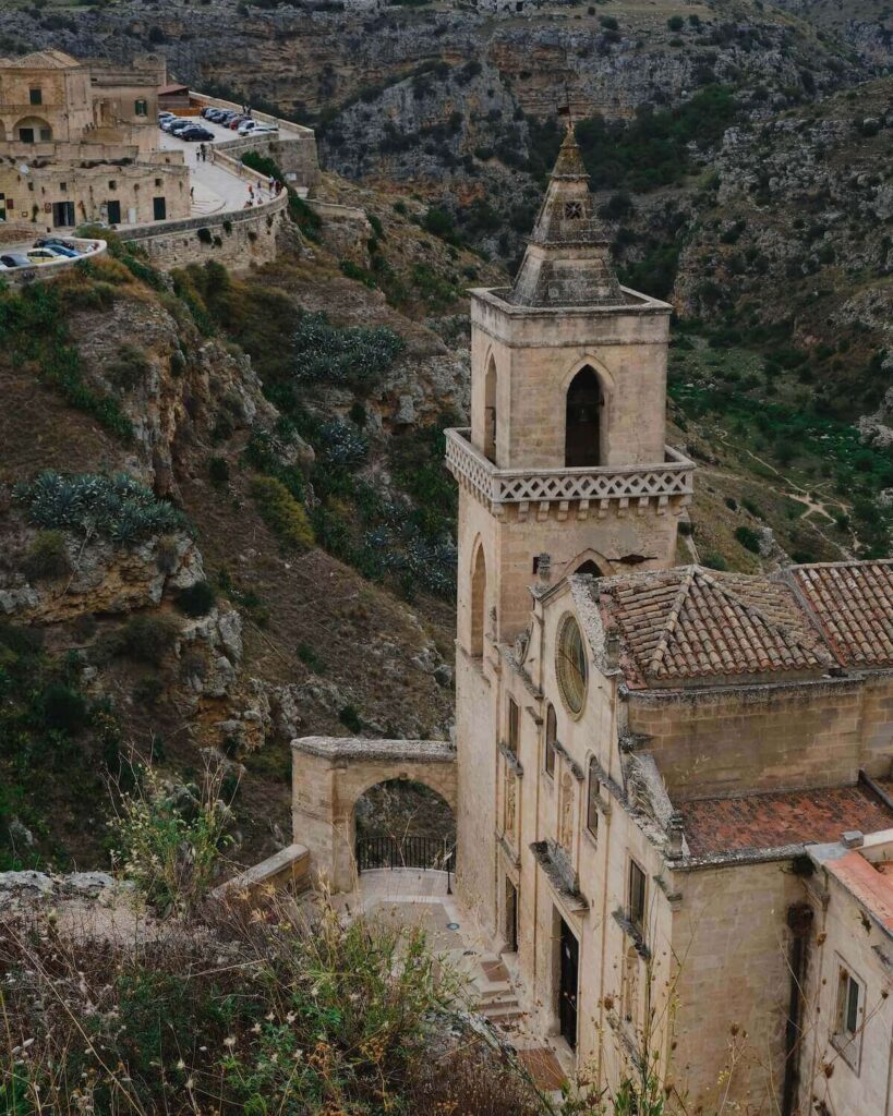 View from above of Matera rock church with ravine as backdrop