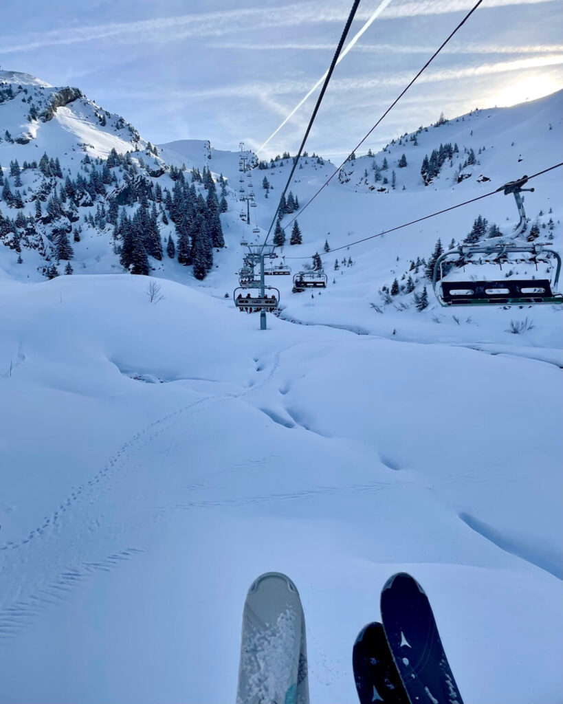 Chairlift to Switzerland in Montriond with powder snow below