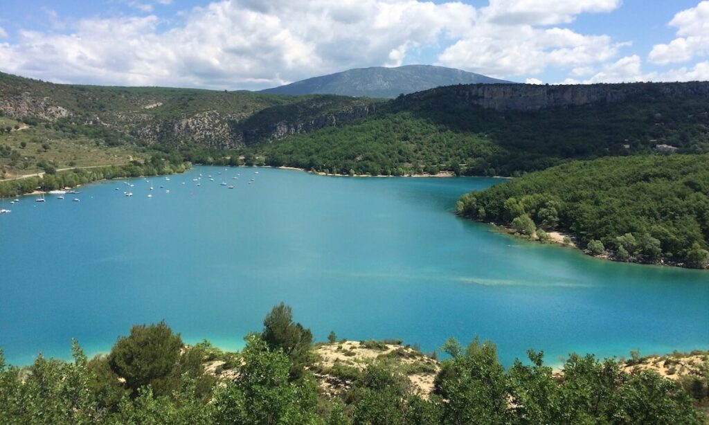 Gorges du Verdon - green lake with forest around on cloudy day