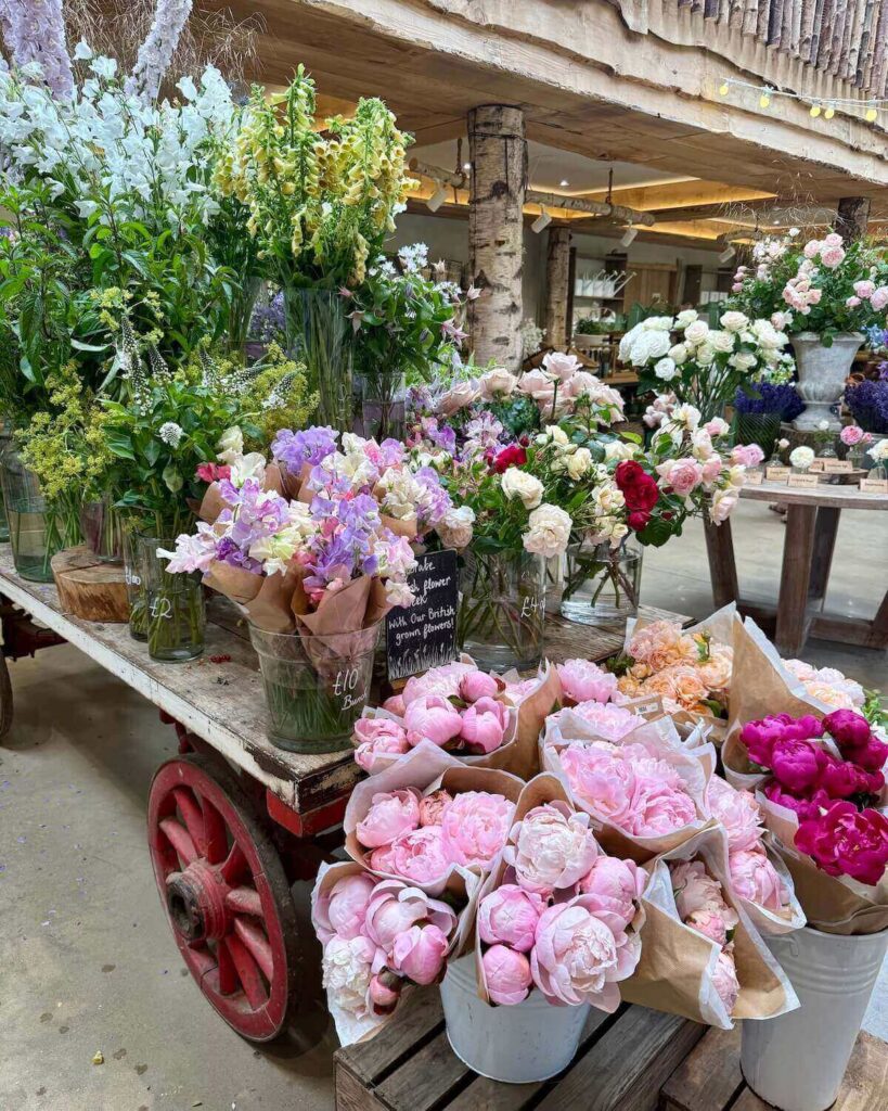 Bouquets of vibrant flowers on stand in Daylesford Organic farm shop