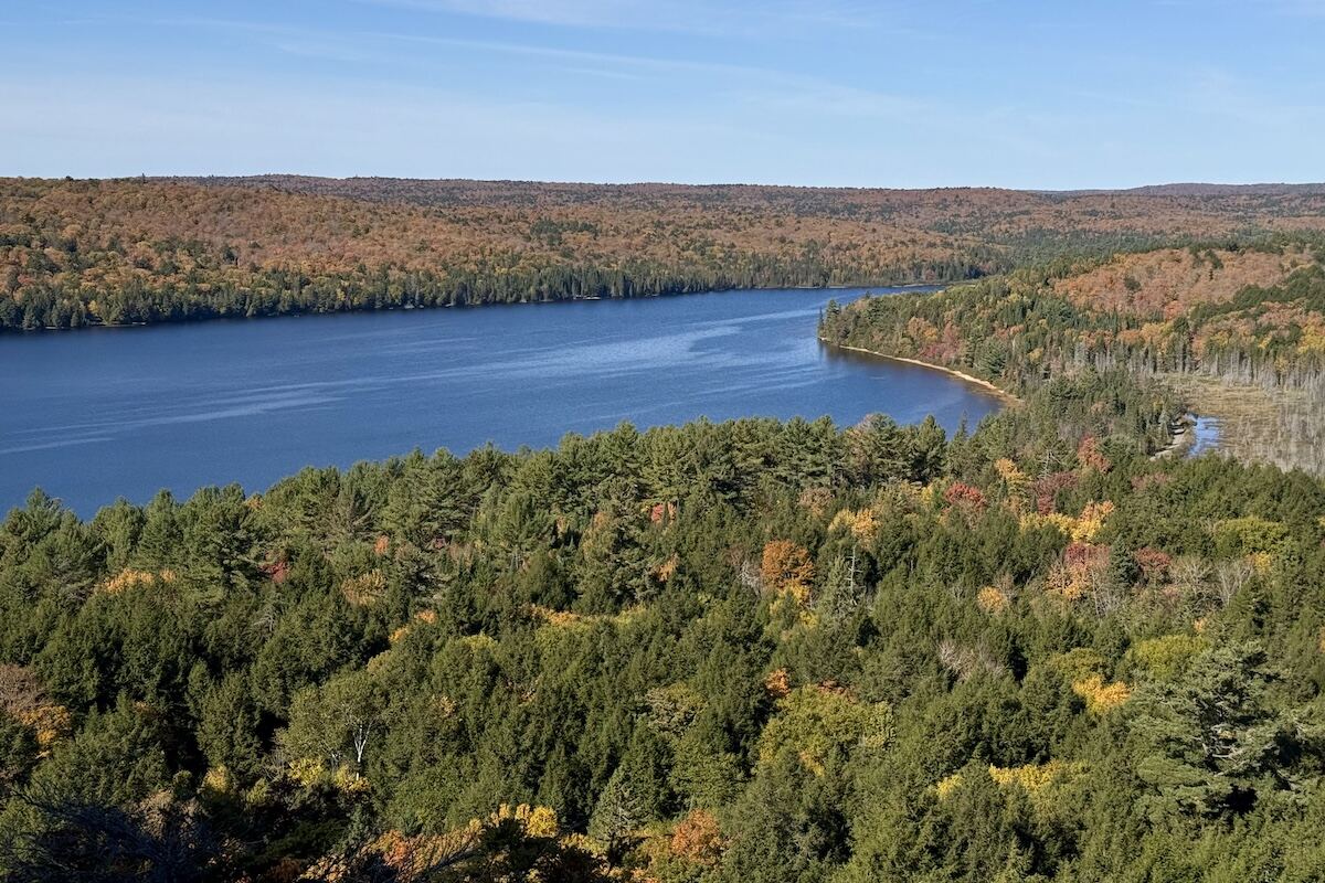 Beautiful view of Rock Lake and thick forest in autumnal colours from Booth's Rock