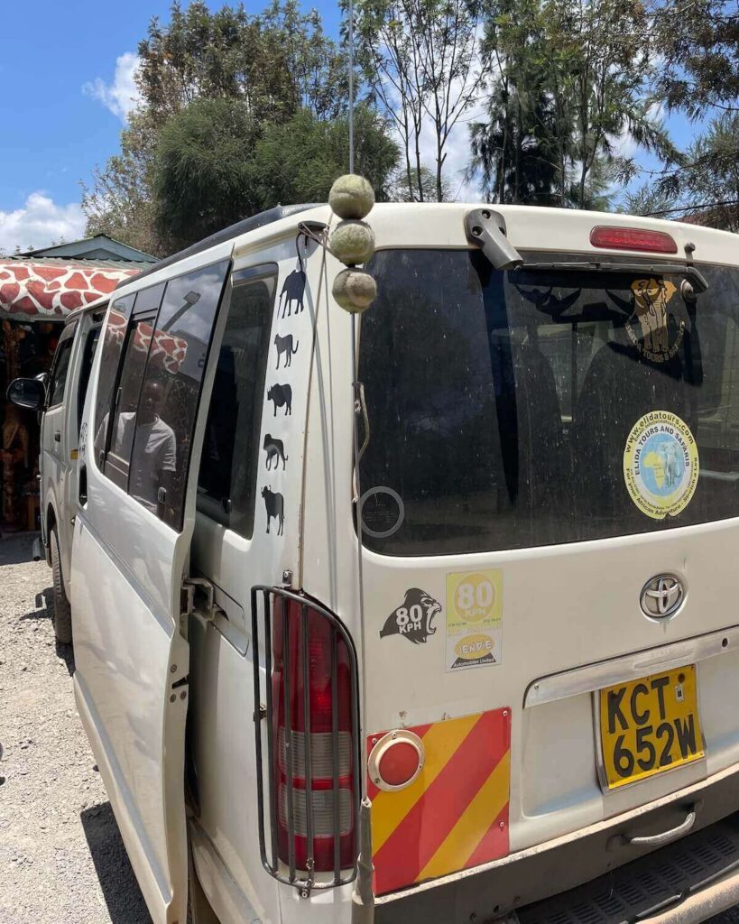 Nairobi National Park tour vehicle with sliding door open and animal stickers