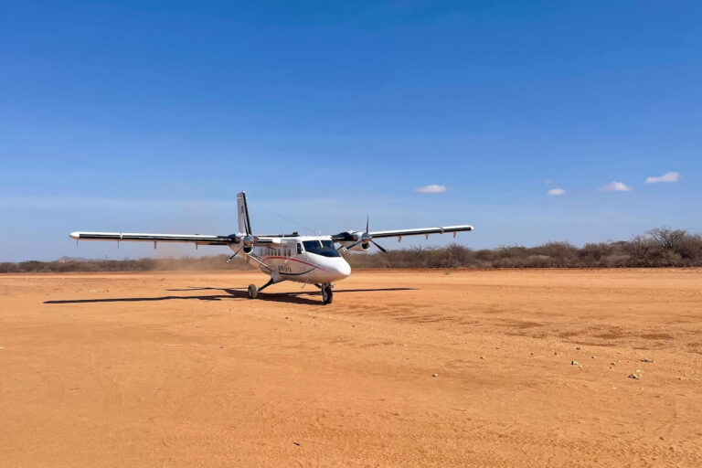 Light aircraft on Samburu dirt airstrip - showing where safari luggage has to fit in the plane