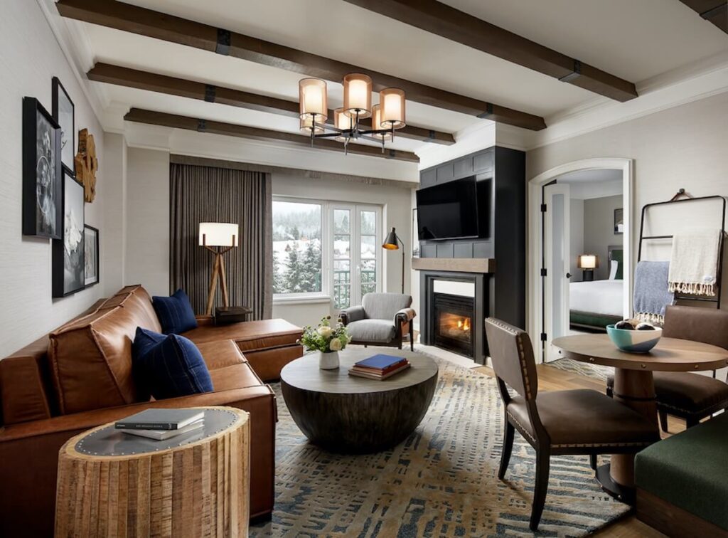 Fairmont Chateau Whistler - Fairmont Gold - Executive Suite Living Room with brown leather sofa and mountain view