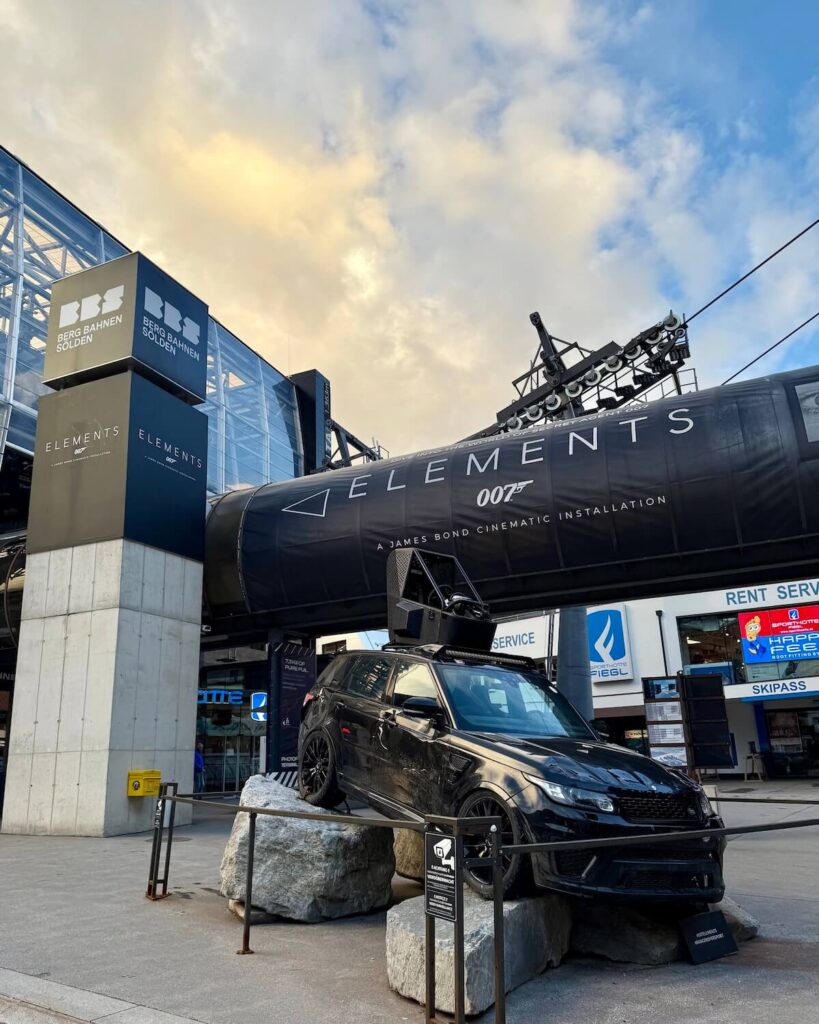 Range Rover for James Bond Spectre film with ski and toboggan rental shop in back at lift station in Solden