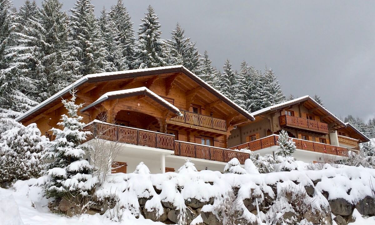 Large Bernex ski chalets under snow