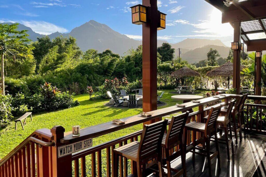 AMA Hanalei one of the best places to eat on Kauai - the view from terrace with green garden and mountains on a sunny day